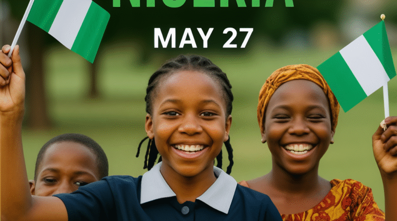 Smiling Nigerian children holding flags celebrating Children’s Day on May 27